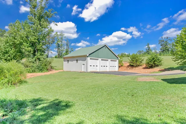 a room with wooden floor and pool table