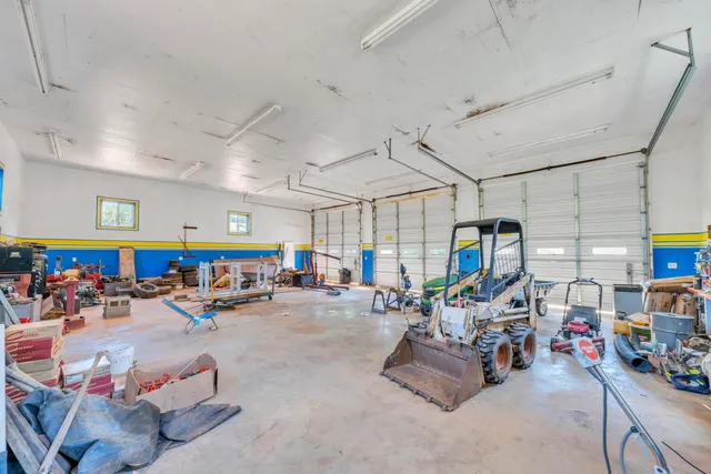 an empty room with a empty space and a ceiling fan