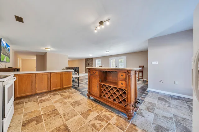 a kitchen with stainless steel appliances granite countertop a sink and stove