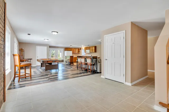 a view of house with yard and entertaining space
