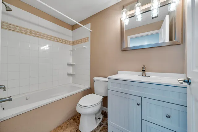 a view of a house with patio dining space and garden view