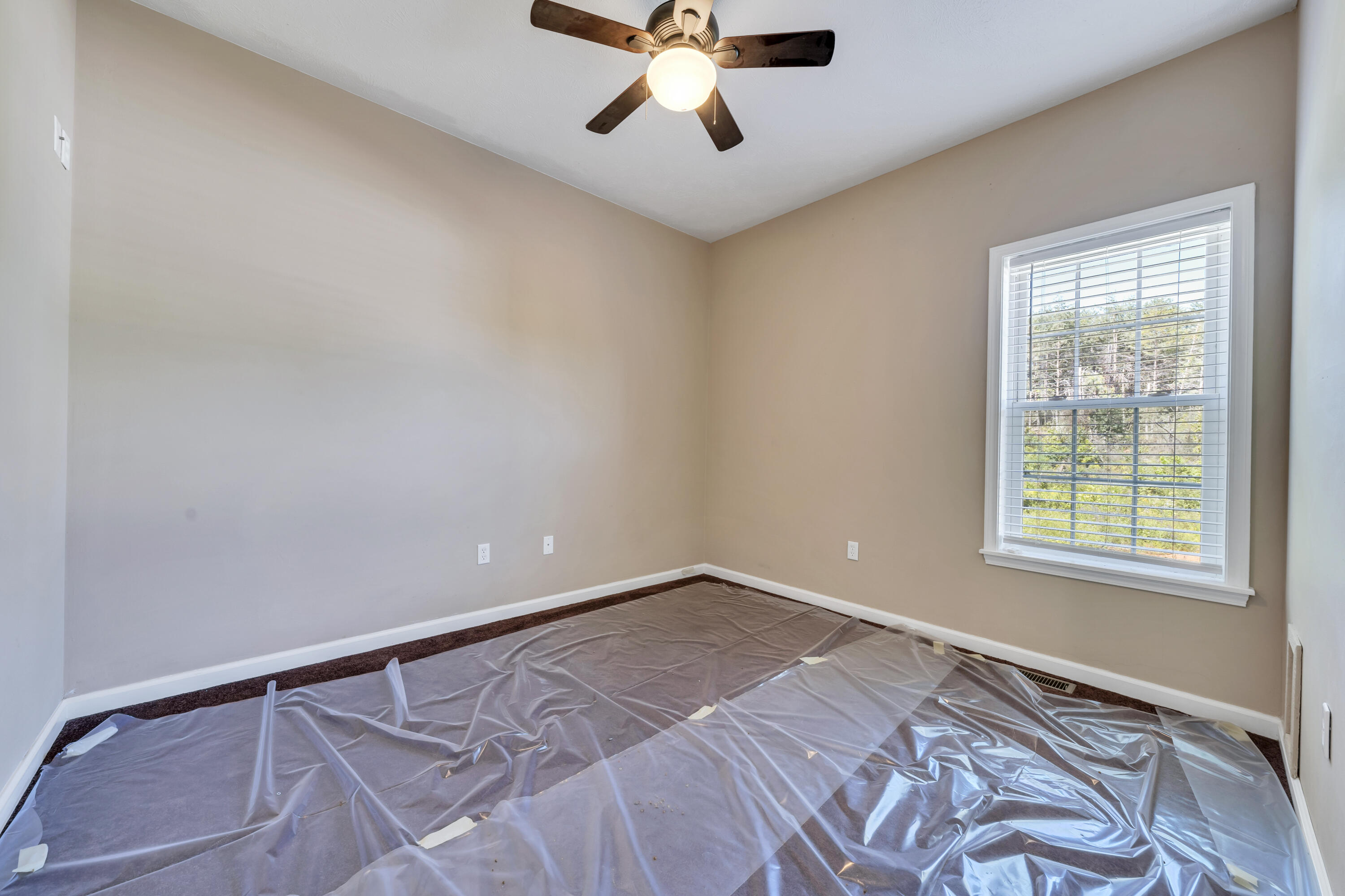 319 Cooks Knob Road Ferrum, VA 24088 - Photo 62 of 80 a view of a room with a ceiling fan and a window