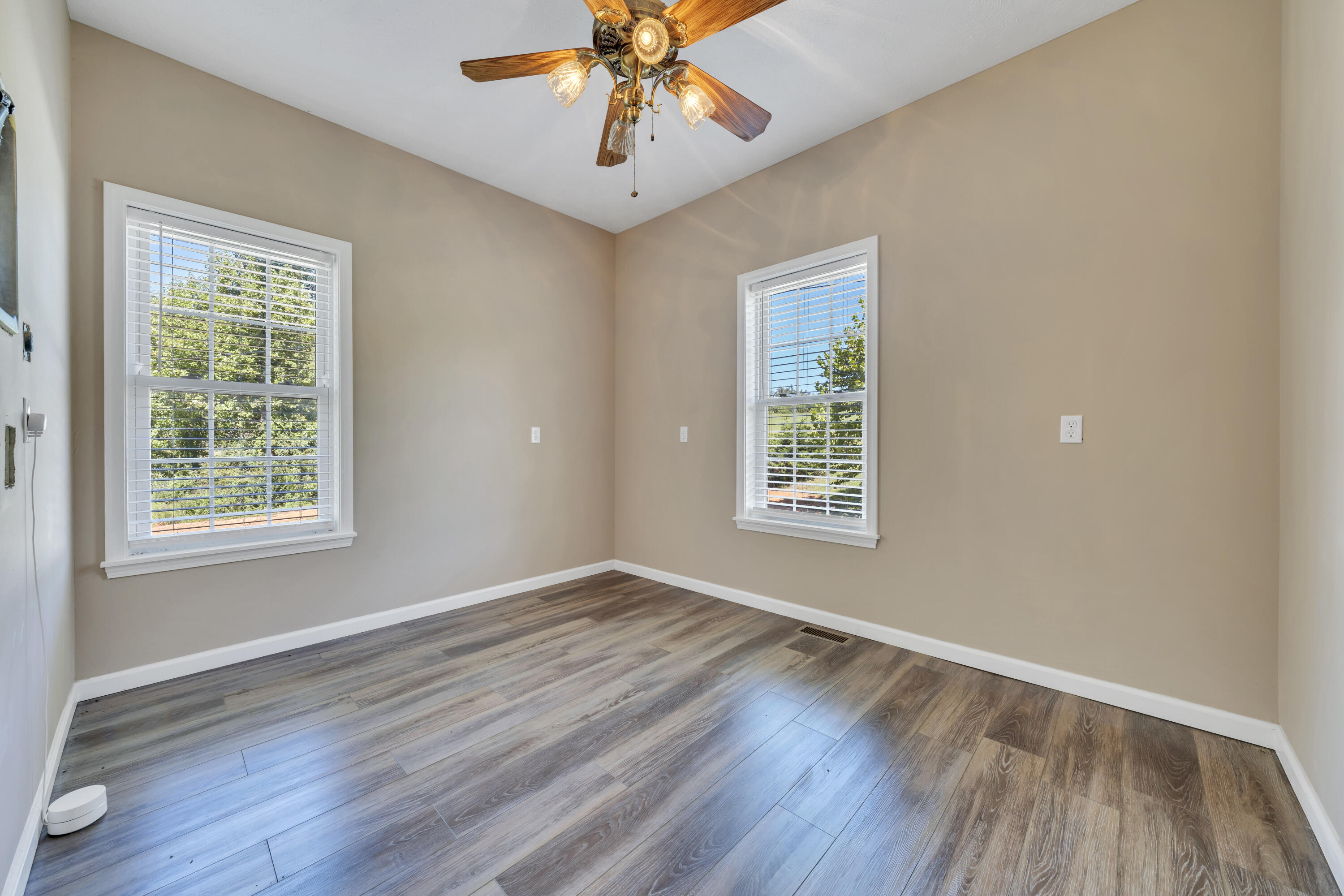 319 Cooks Knob Road Ferrum, VA 24088 - Photo 64 of 80 a view of an empty room with wooden floor and a window
