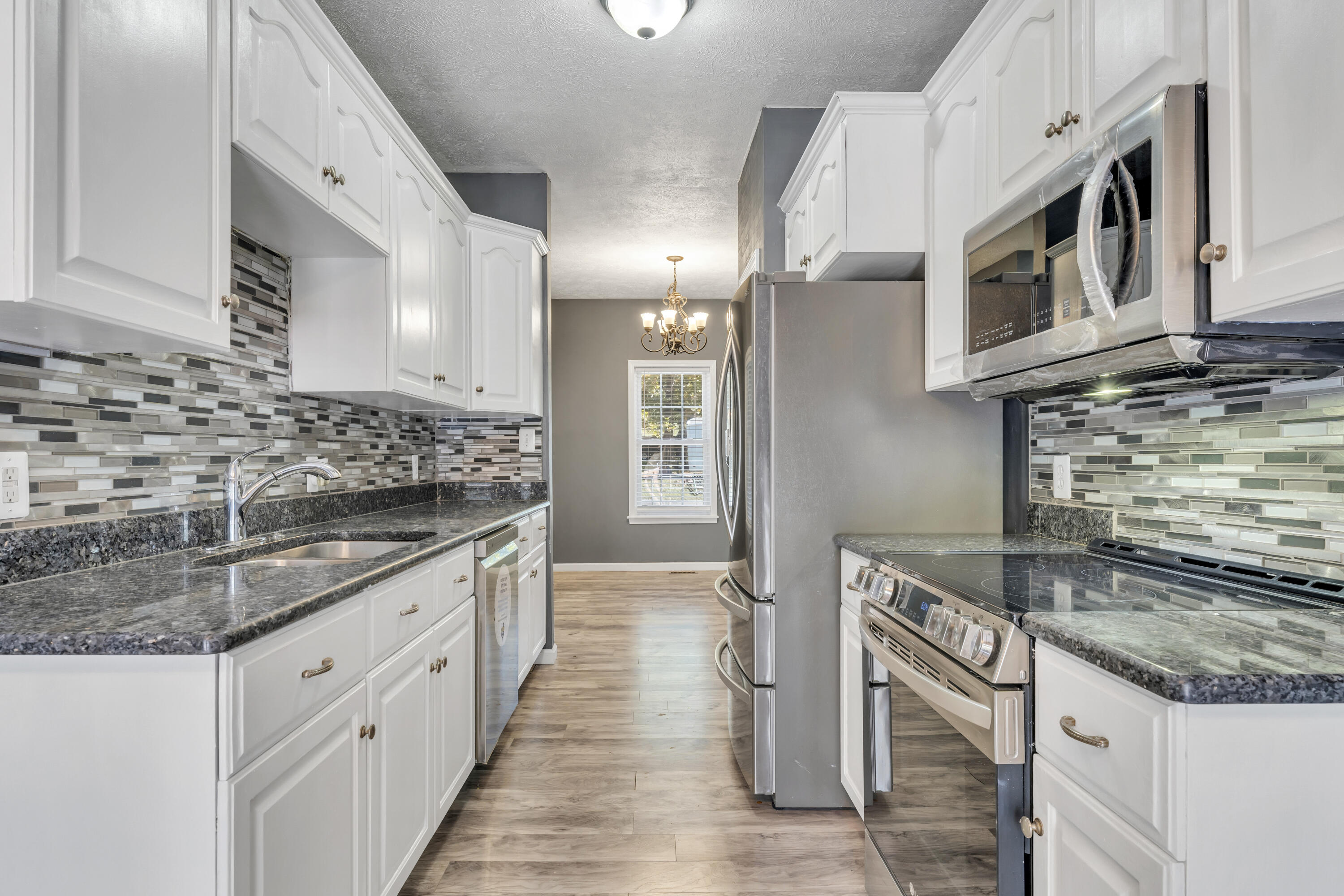 319 Cooks Knob Road Ferrum, VA 24088 - Photo 72 of 80 a kitchen with stainless steel appliances granite countertop a sink and stove