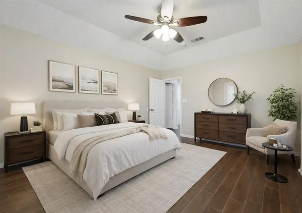 a view of an empty room and wooden floor