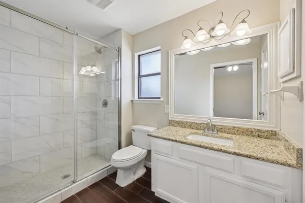 a bedroom with a bed and dresser