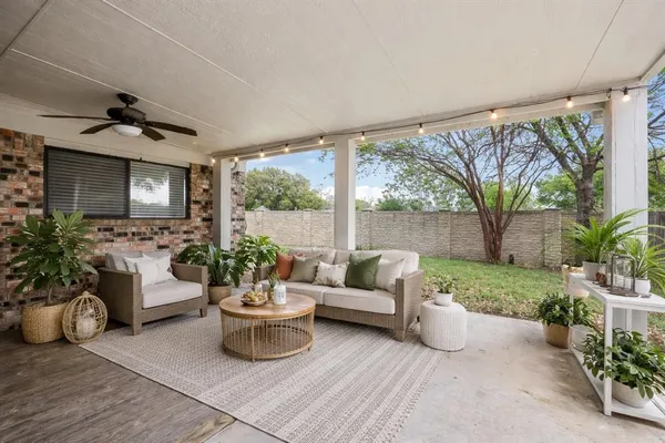 a view of a livingroom with wooden floor and outdoor space