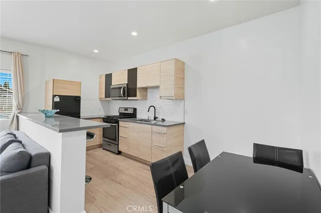 a living room with furniture window and a table