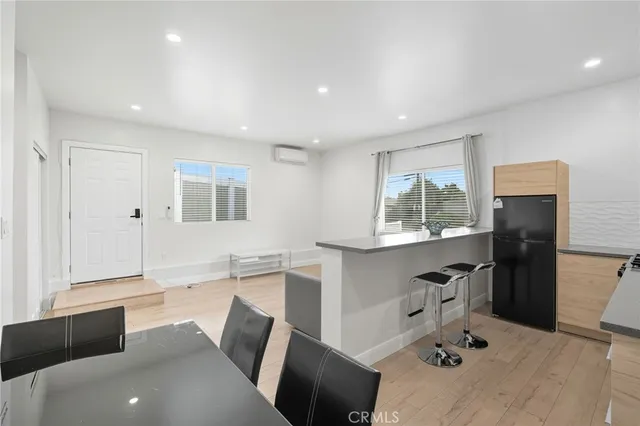 a kitchen with a sink a counter top space and stainless steel appliances