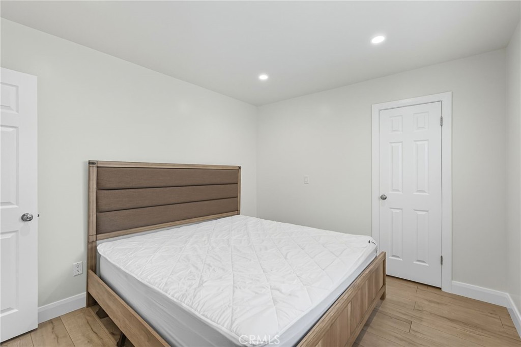 11642 Gothic Avenue Granada Hills, CA 91344 - Photo 18 of 27 a large bed sitting in a room next to a window