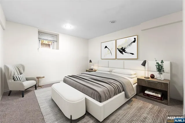 a bedroom with a bed and a couch