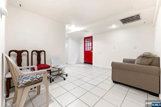 a living room with furniture and window