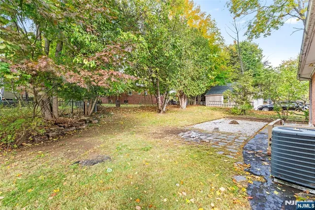 a view of yard with swimming pool