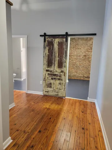 a view of front door with wooden floor
