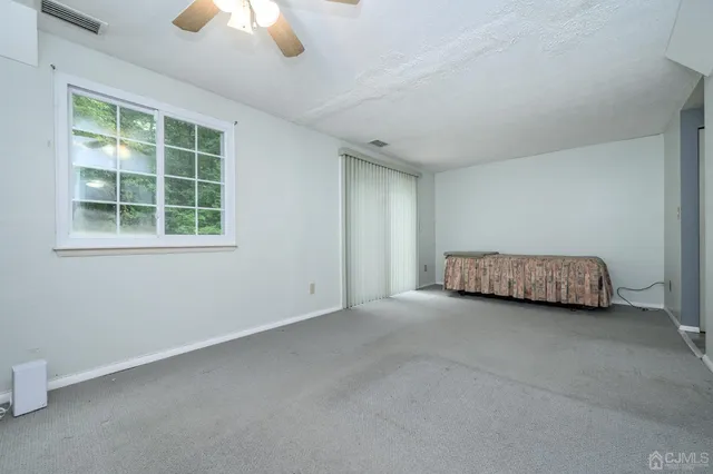 a kitchen with granite countertop a sink and a stove