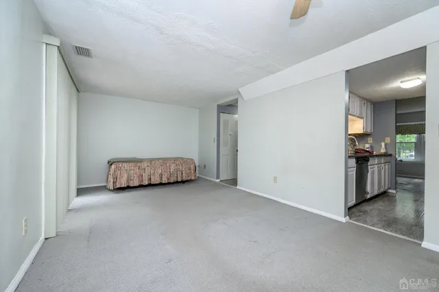 a kitchen with granite countertop a sink stainless steel appliances and cabinets