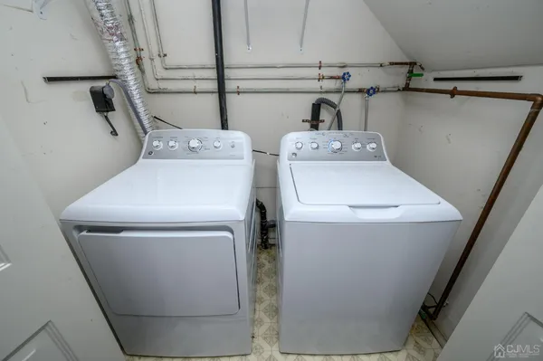 a bathroom with a tub and window