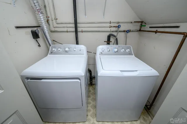 a bathroom with a tub and window