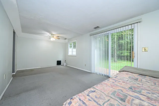 a view of a livingroom and a bathroom