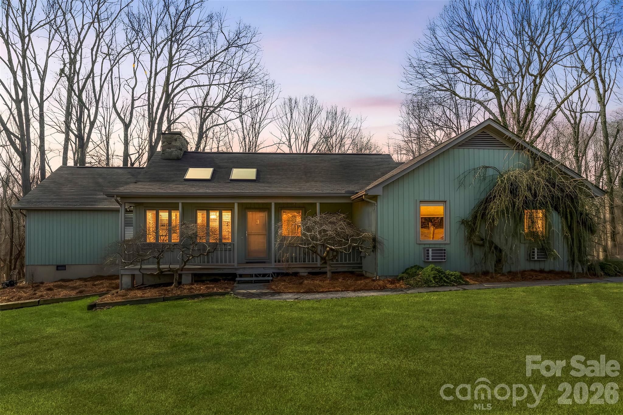 4242 John Ritchie Road Iron Station, NC 28080 - Photo 2 of 46 a front view of a house with a garden