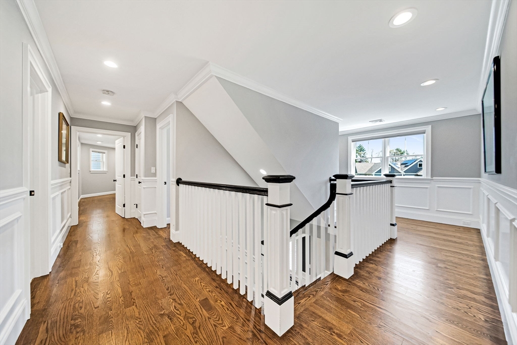 17 Sunrise Terrace Needham, MA 02492 - Photo 27 of 42 a view of a hallway with the wooden floor and staircase