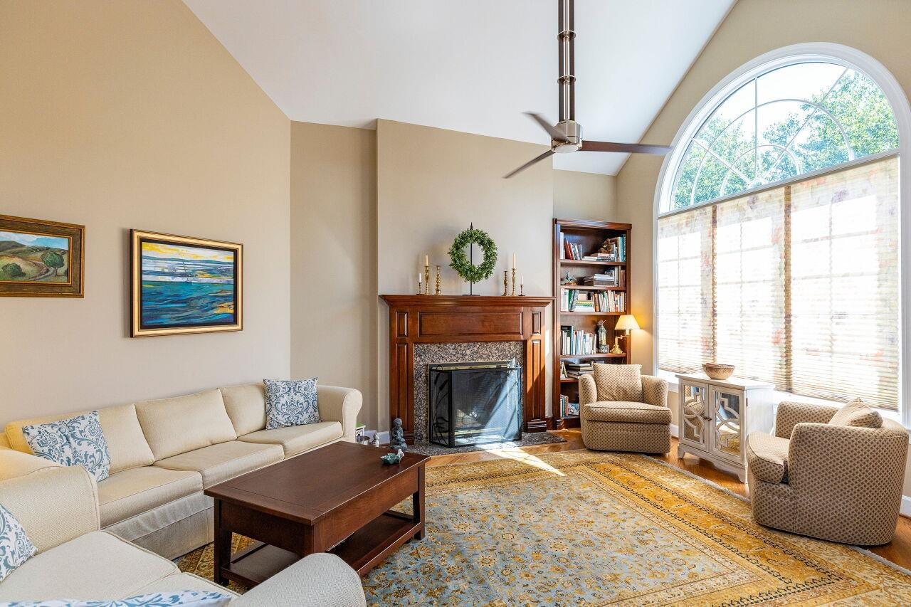 With vaulted ceilings and ample windows, this room is warm and inviting. Living Room