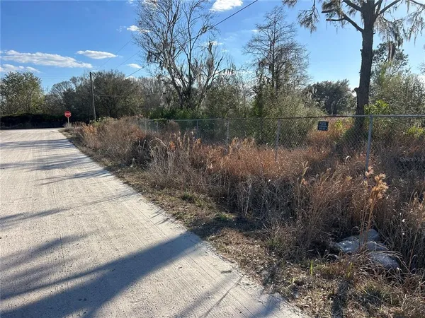 a view of lake with a yard