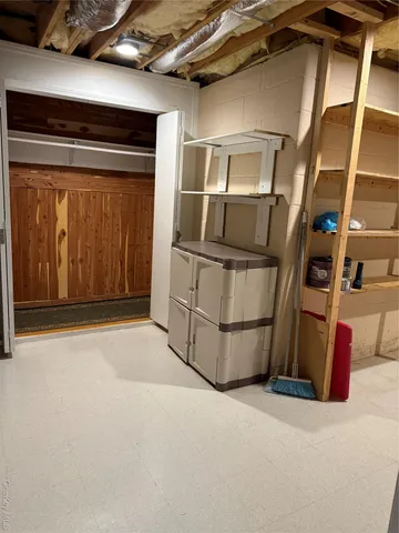 a view of an empty room with wooden walls