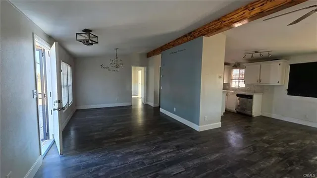 a view of a refrigerator in kitchen and wooden floor