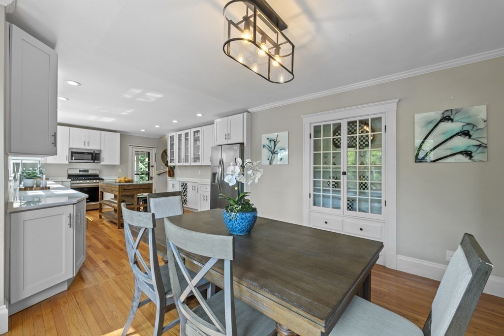 26 Cedar Street, Unit 2 Marblehead, MA 01945 - Photo 14 of 37 a view of a dining room with furniture window and wooden floor