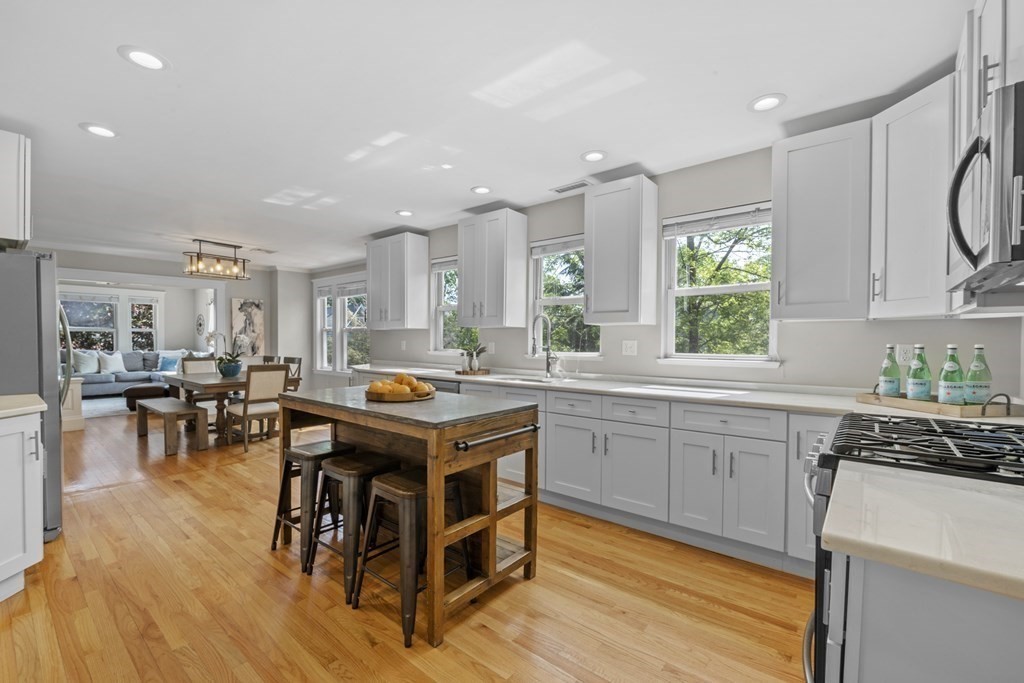 26 Cedar Street, Unit 2 Marblehead, MA 01945 - Photo 19 of 37 a kitchen with counter space appliances and a dining table