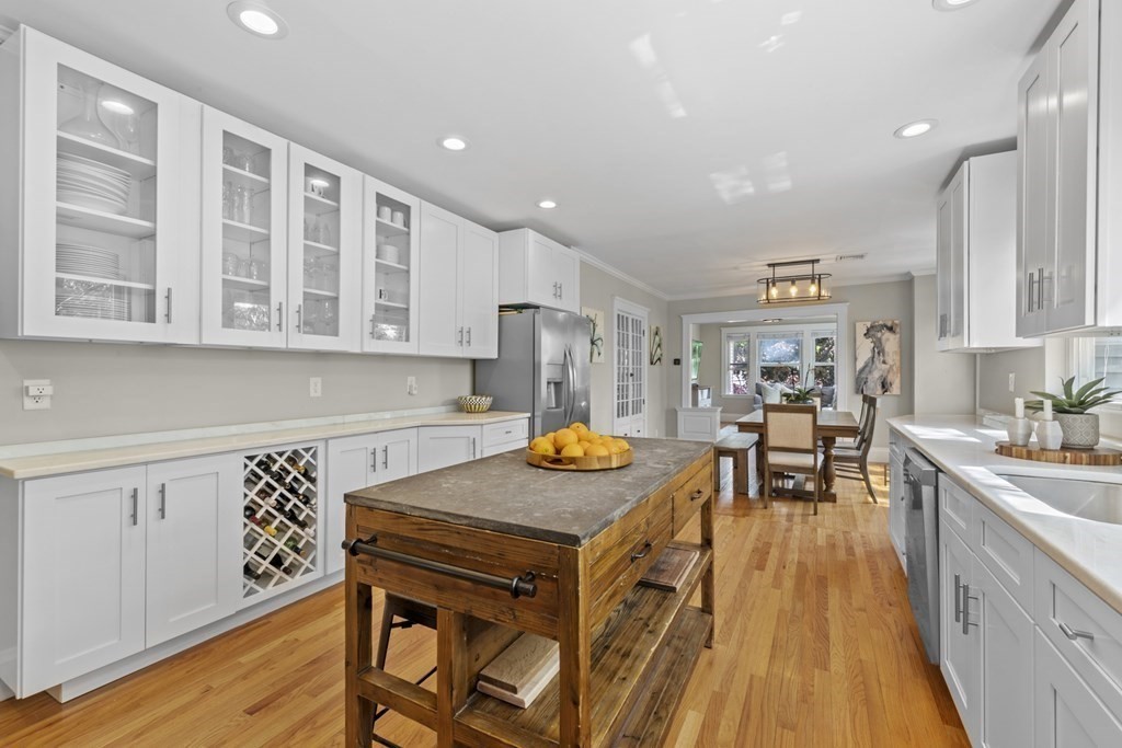 26 Cedar Street, Unit 2 Marblehead, MA 01945 - Photo 20 of 37 a kitchen with stainless steel appliances granite countertop a stove and a sink