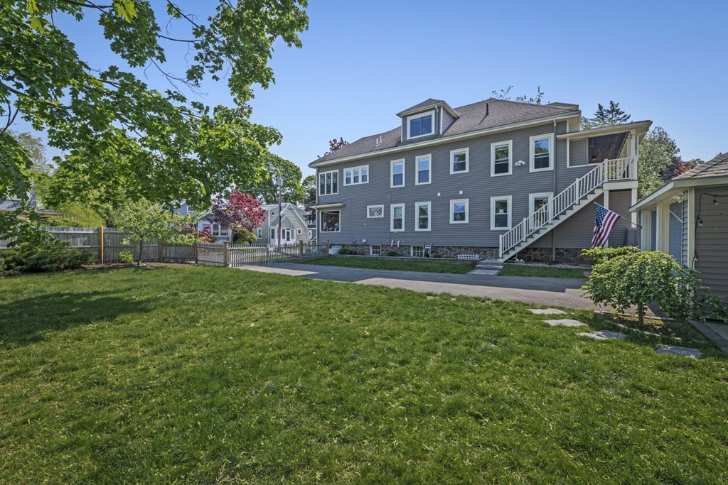 26 Cedar Street, Unit 2 Marblehead, MA 01945 - Photo 2 of 37 a view of a house with a yard and sitting area