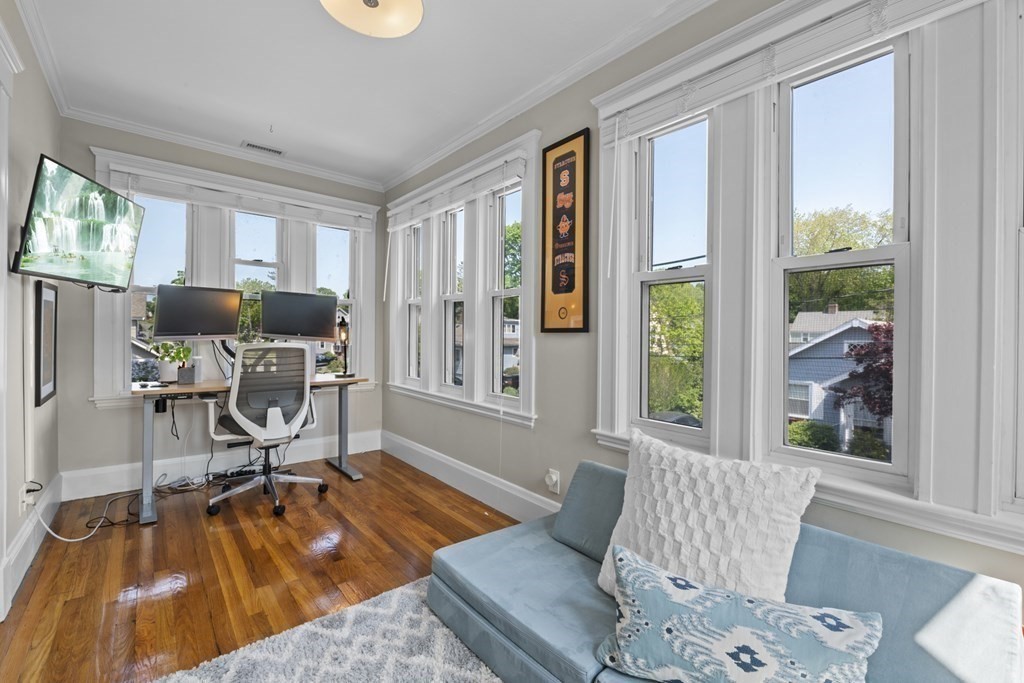 26 Cedar Street, Unit 2 Marblehead, MA 01945 - Photo 24 of 37 a living room with furniture and a wooden floor
