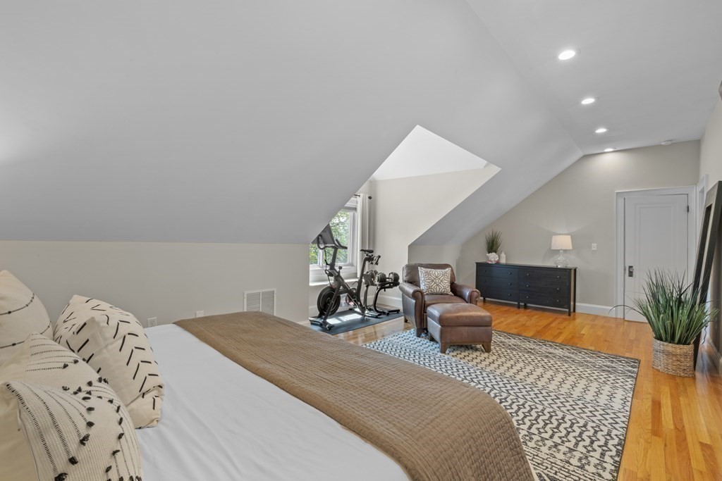 26 Cedar Street, Unit 2 Marblehead, MA 01945 - Photo 29 of 37 a bedroom with a bed window and couch