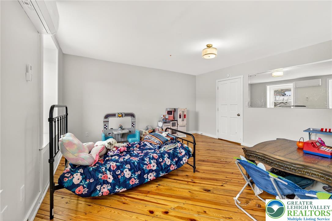22 South 1st Street Bangor, PA 18013 - Photo 29 of 79 a bedroom with furniture and a chandelier