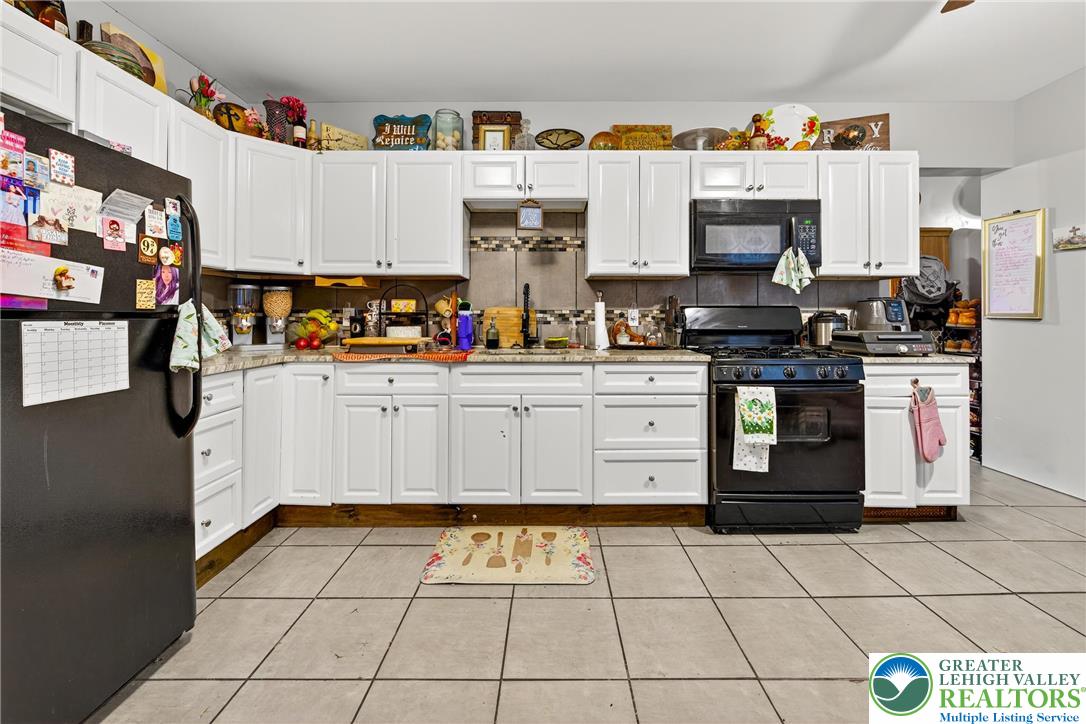 22 South 1st Street Bangor, PA 18013 - Photo 45 of 79 a kitchen with stainless steel appliances a stove a sink and a refrigerator