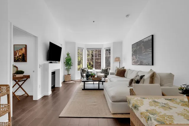 a kitchen with a granite countertop sink stove and refrigerator
