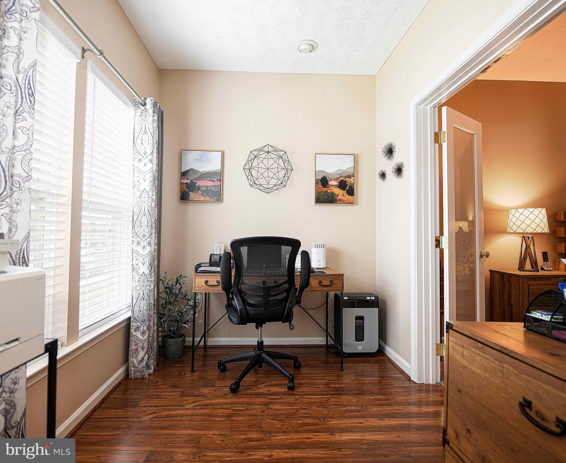 9506 Amberleigh Lane, Unit 9506A Perry Hall, MD 21128 - Photo 26 of 33 a view of a workspace with furniture and a window