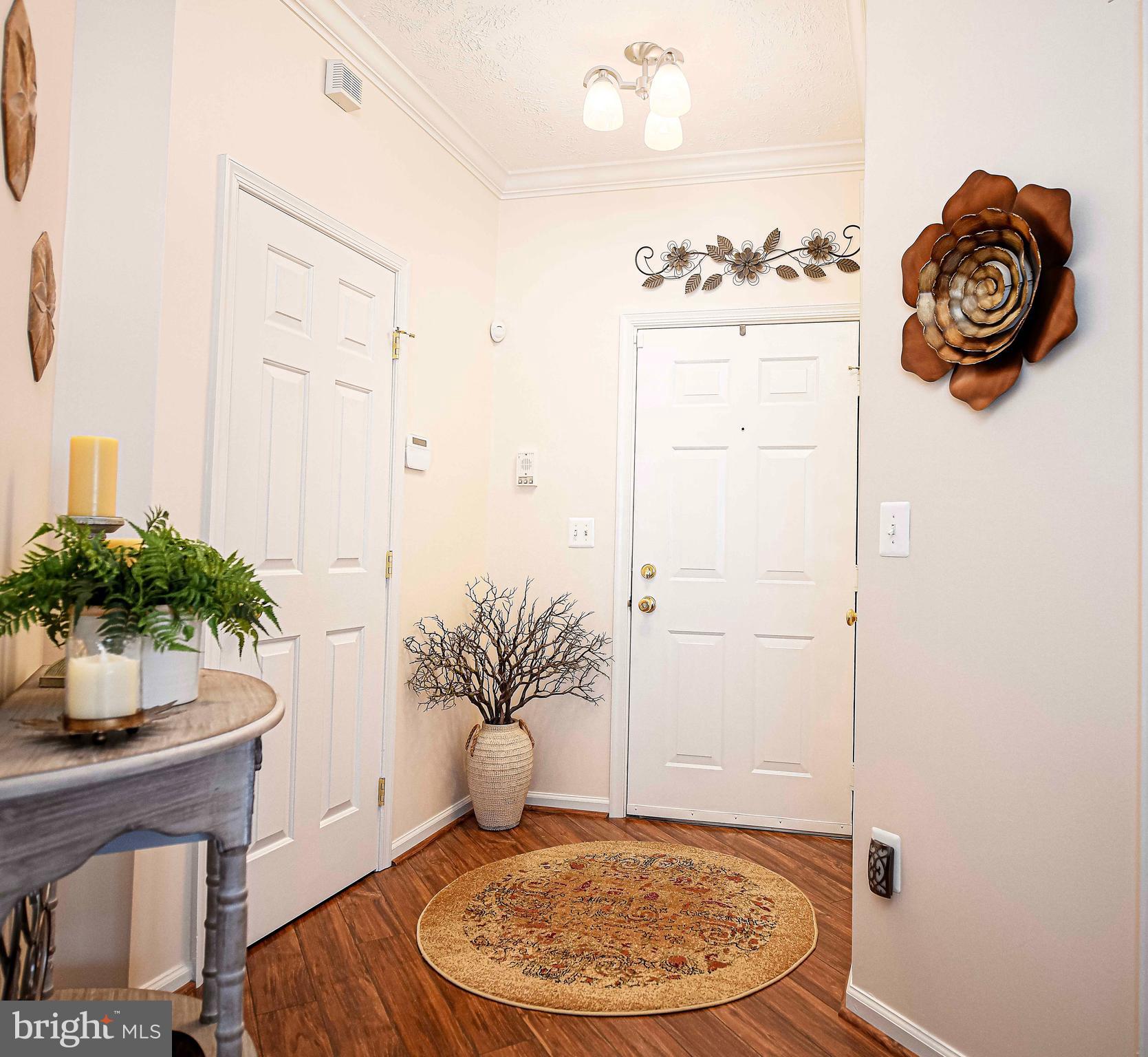 9506 Amberleigh Lane, Unit 9506A Perry Hall, MD 21128 - Photo 10 of 33 a view of a livingroom with table and chair