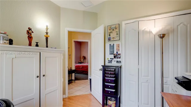 a view of walk in closet with clothes