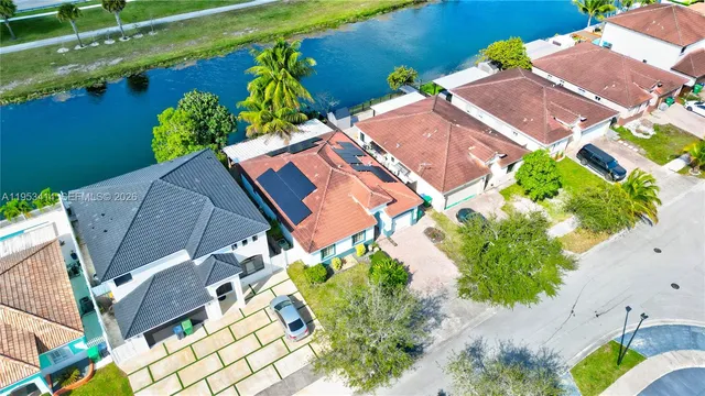 an aerial view of a house a yard and a garden