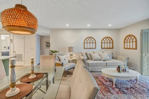 a living room with furniture and a table