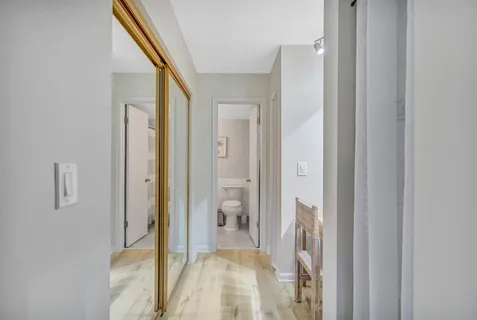 a view of a bathroom from a hallway