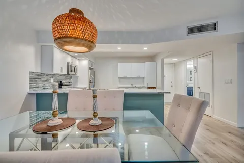 a view of a dining room with furniture and a wooden floor