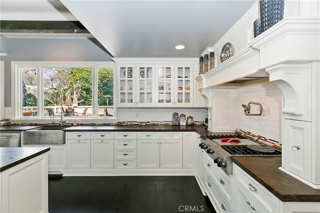 3124 Pachappa Drive Riverside, CA 92506 - Photo 21 of 50 a kitchen with granite countertop a stove and a sink
