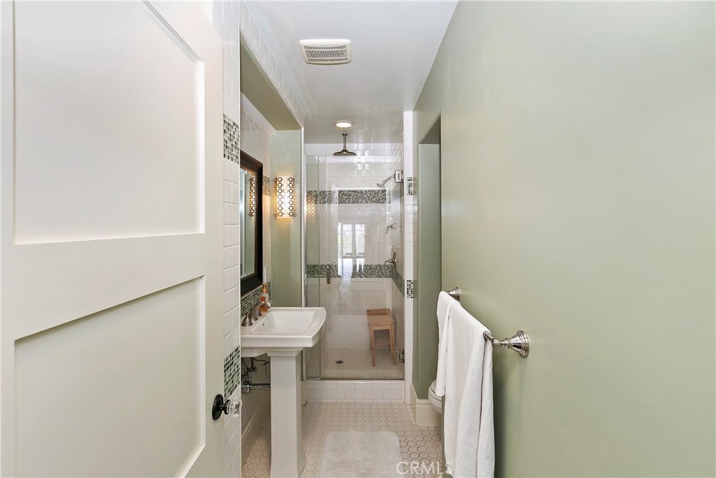3124 Pachappa Drive Riverside, CA 92506 - Photo 25 of 50 a bathroom with a sink a mirror and a shower