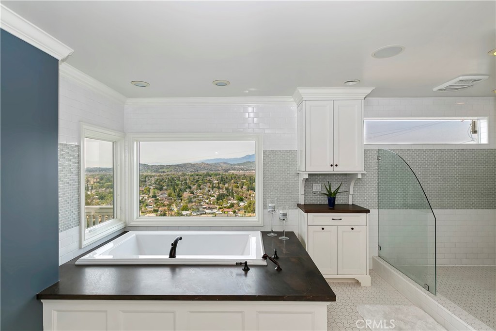 3124 Pachappa Drive Riverside, CA 92506 - Photo 34 of 50 a kitchen with a sink a counter top space and cabinets