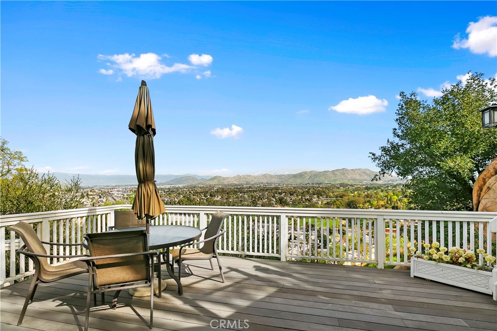 3124 Pachappa Drive Riverside, CA 92506 - Photo 42 of 50 a view of a balcony with wooden chairs and floor to ceiling window