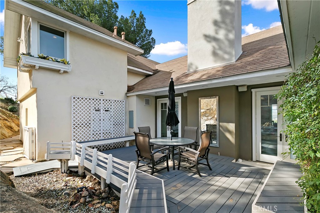 3124 Pachappa Drive Riverside, CA 92506 - Photo 44 of 50 a view of a patio with a table and chairs